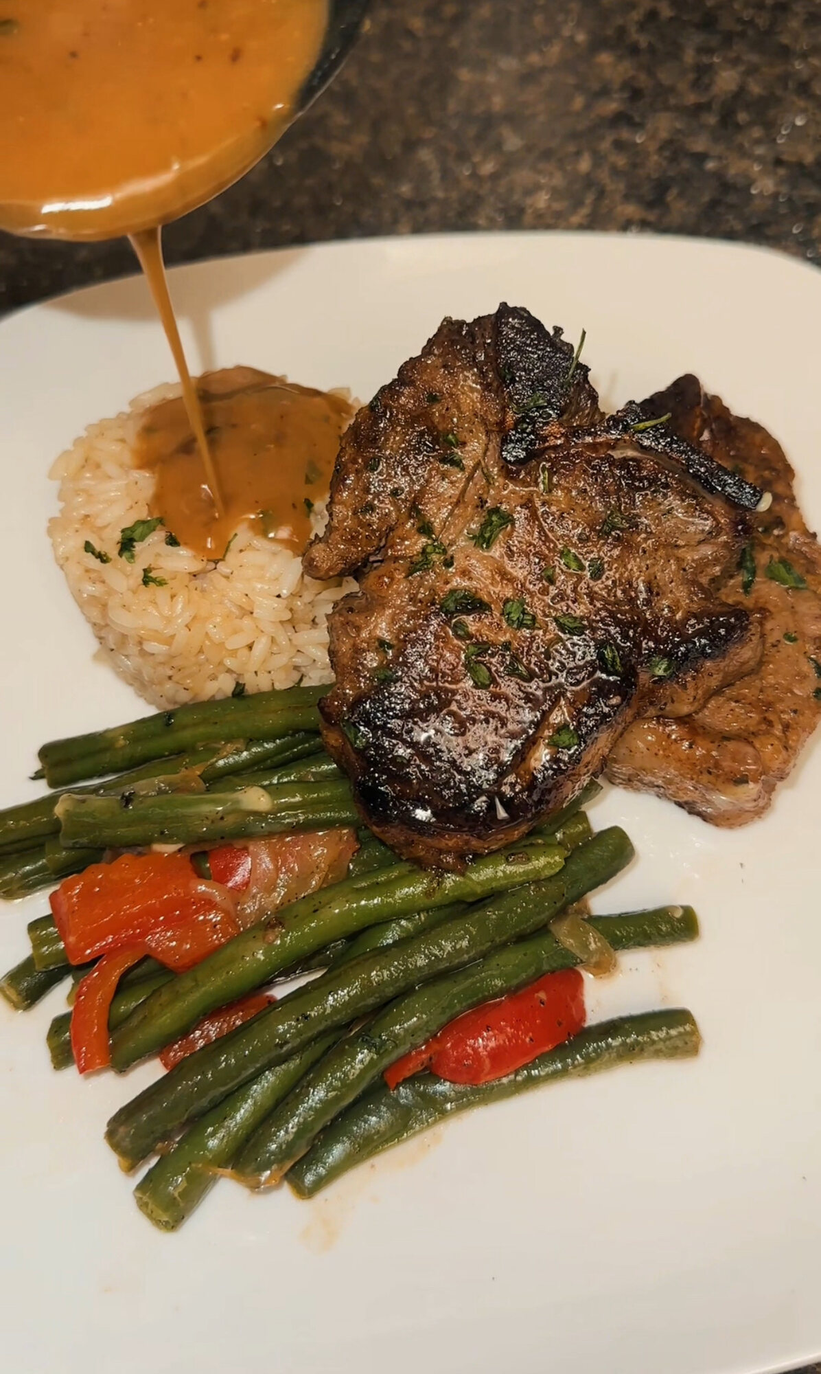 Steak dinner with rice and vegetables